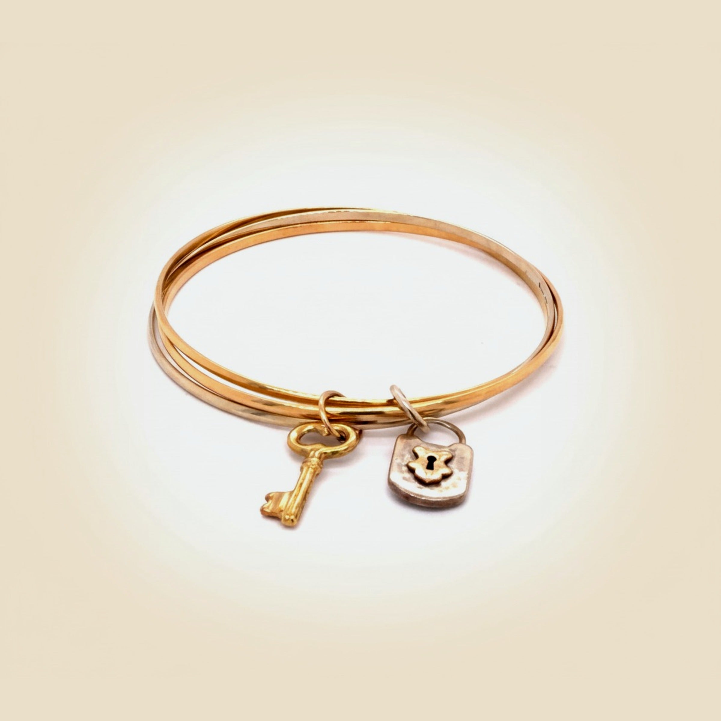 Trio of Two Tone 18k Bangle Bracelets w/Lock & Key