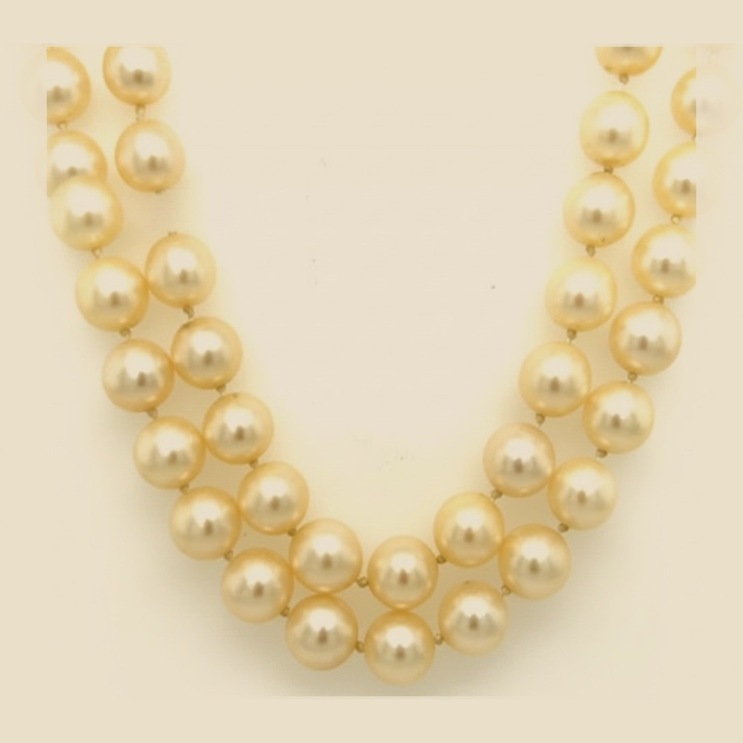 White Gold Clasp on a Double Strand of Graduated Pearls – Empire Diamond